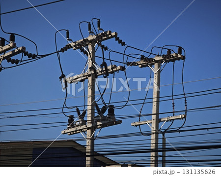 Electrical pole with electrical cables against the sky. 131135626
