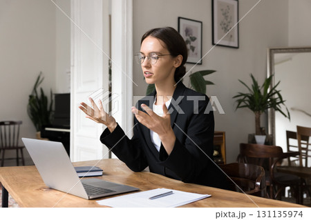 Young woman teacher hold lesson from home office via videocall 131135974