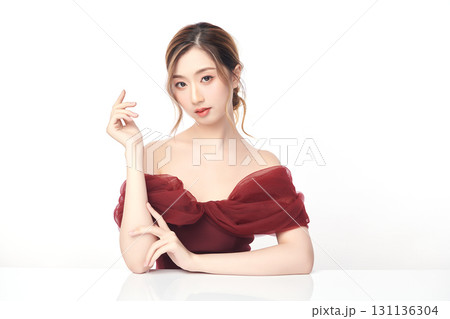 A beautiful young Asian woman with clean, fresh skin against a white background. Skincare, facial treatment, cosmetology, beauty, and spa. An elegant portrait of an Asian woman. A beautiful young Asian woman with clean, fresh skin against a white background. Skincare, facial treatment, cosmetology, beauty, and spa. An elegant portrait of an Asian woman. 131136304