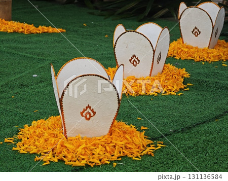 The Lanna lamp with marigold petals. 131136584