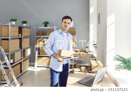 Portrait Of Man Working In Online Store Warehouse Portrait Of Man Working In Online Store Warehouse 131137221