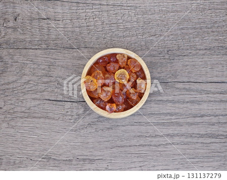 Peach gum in wooden bowl. Peach gum in wooden bowl. 131137279