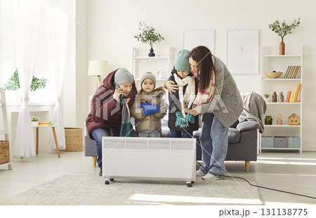 Family feeling cold at home trying to solve problem with heating 131138775