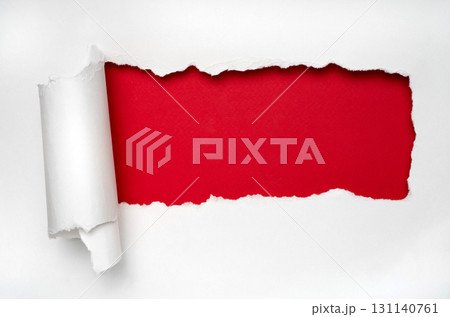 Red reveal under white torn paper, sale banner background with copy space 131140761