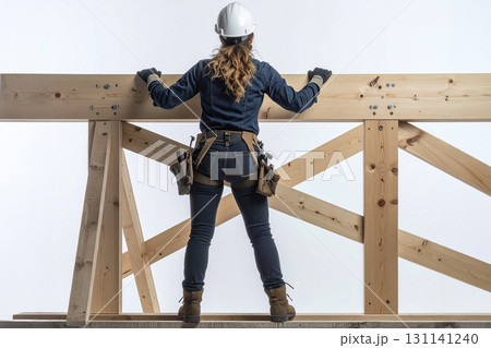 a worker works on a wooden scaffold isolated 131141240