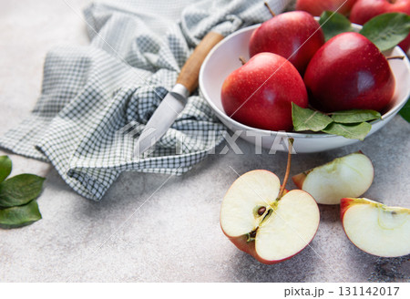 Fresh red apples in bowl with knife Fresh red apples in bowl with knife 131142017