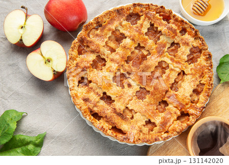 Delicious homemade apple pie with honey and coffee enjoyed during autumn season 131142020