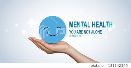 World Mental Health Day concept with hands holding happy smile face symbol, promoting support, awareness, positivity and emotional wellbeing, you are not alone. World Mental Health Day concept with hands holding happy smile face symbol, promoting support, awareness, positivity and emotional wellbeing, you are not alone. 131142346
