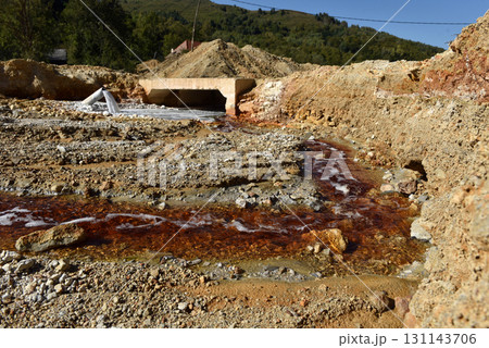Toxic gold mining residual waters from gold mine flowing and polluting environment 131143706