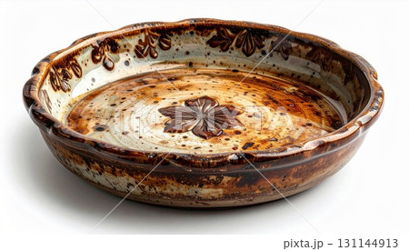 Rustic Ceramic Pie Dish with Floral Center and Brown Accents on White 131144913