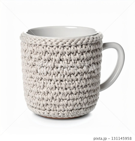 Ceramic Mug Adorned with Beige Crochet Cover Isolated on White Background For Cozy and Warm Drink Ceramic Mug Adorned with Beige Crochet Cover Isolated on White Background For Cozy and Warm Drink 131145958