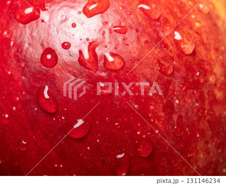 Close Up of a Fresh Red Apple with Water Droplets on Its Surface with Bright Studio Lighting 131146234