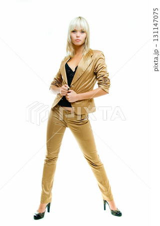 posing in gold suit 131147075