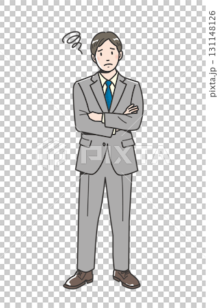 The whole body of a worried young businessman with his arms crossed 131148126