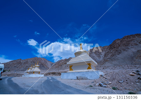 Himalayan Buddhist Stupas by Mountain Road 131150336