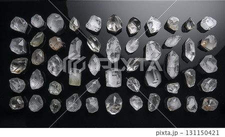 A row of white crystals on a black background 131150421
