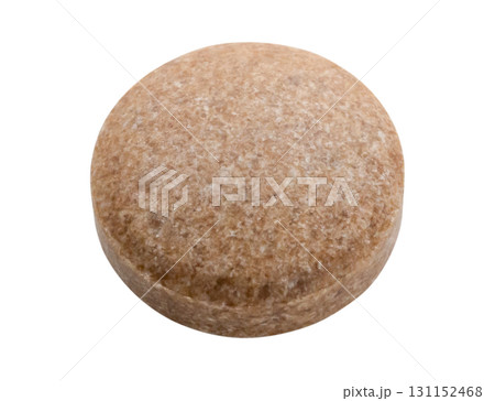 Brown herbal pill tablet isolated on white background 131152468