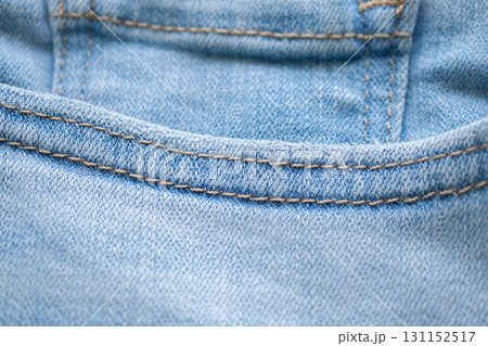 Old denim blue jeans fabric texture background close up Old denim blue jeans fabric texture background close up 131152517