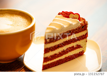 Homemade cake Red Velvet decorated with cream and cup of coffee Homemade cake Red Velvet decorated with cream and cup of coffee 131152787