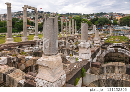 Partially restored Roman columns and stone arches in the ruins of the ancient Agora of Smyrna in Izmir Turkey 131152896