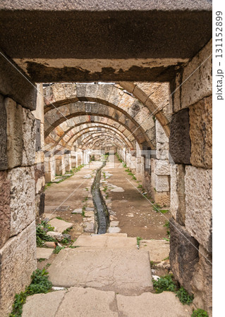 Ancient stone arches and drainage channel in Roman-era ruins of Agora of Smyrna Izmir Turkey Ancient stone arches and drainage channel in Roman-era ruins of Agora of Smyrna Izmir Turkey 131152899