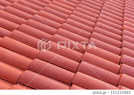 Close-up view of red clay roof tiles arranged in orderly rows Close-up view of red clay roof tiles arranged in orderly rows 131155083