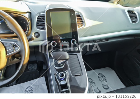 Experience the modern interior of a sleek car showcasing advanced technology and a spacious design for comfortable journeys 131155226