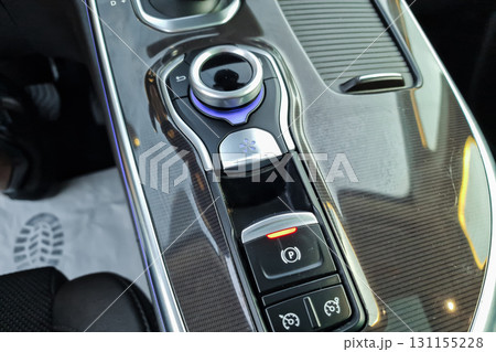Luxury car interior showcases modern control panel with sleek design and advanced features for a comfortable driving experience in an elegant vehicle Luxury car interior showcases modern control panel with sleek design and advanced features for a comfortable driving experience in an elegant vehicle 131155228