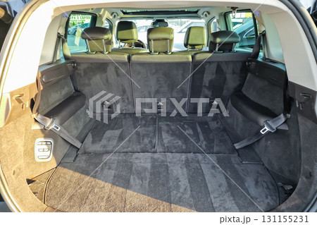Empty spacious rear cargo area of a modern SUV at a dealership during daytime Empty spacious rear cargo area of a modern SUV at a dealership during daytime 131155231