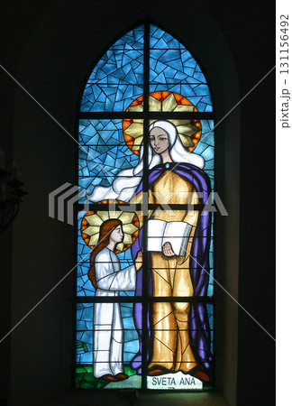 Saint Anne, Education of the Virgin Mary, stained glass window at Our Lady of Miracles Parish Church in Ostarije, Croatia Saint Anne, Education of the Virgin Mary, stained glass window at Our Lady of Miracles Parish Church in Ostarije, Croatia 131156492