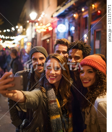 group of friends taking selfie city street night 131157571