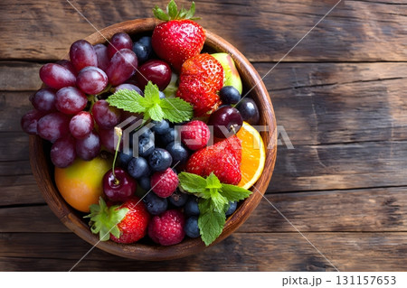 bowl of fruits fresh wooden background healthy 131157653