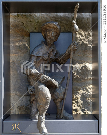 Statue of pilgrims to Santiago de Compostela by Sieger Koder in front of Church of Saint Bartholomew in Leutershausen, Germany Statue of pilgrims to Santiago de Compostela by Sieger Koder in front of Church of Saint Bartholomew in Leutershausen, Germany 131158916