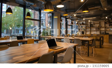 coworking cafe with bright lights laptops open modern furniture 131159005