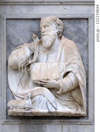 Saint Luke the Evangelist relief on the portal of the Cathedral of Saint Lawrence in Lugano, Switzerland 131159694