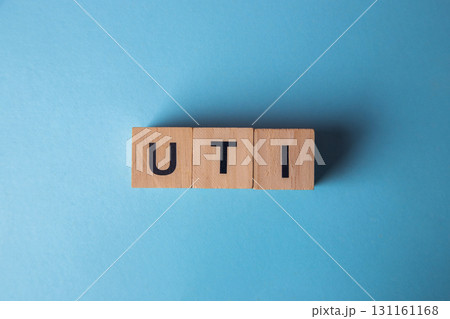 Uti acronym on wooden blocks with blue background 131161168