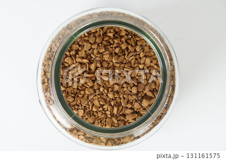 Close up top view of freeze dried instant coffee in a glass jar 131161575