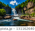 View of beautiful waterfall at the rock cliff in the green forest in spring season in sunny day. 131162640