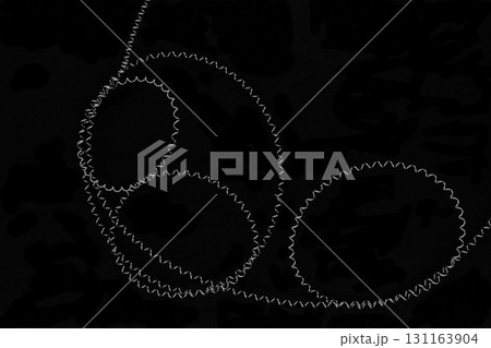 Round shapes of stretched metal springs on black background surface Round shapes of stretched metal springs on black background surface 131163904