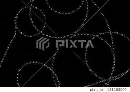 Round shapes of stretched metal springs on black background surface Round shapes of stretched metal springs on black background surface 131163905