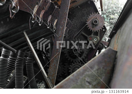 Rusty and grungy rural technical device background with visible different parts Rusty and grungy rural technical device background with visible different parts 131163914
