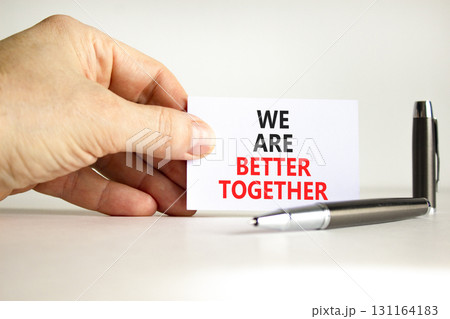 We are better together symbol. Concept words phrase We are better together on beautiful white card. Businessman's hand. Beautiful white background. Business We are better together concept Copy space We are better together symbol. Concept words phrase We are better together on beautiful white card. Businessman's hand. Beautiful white background. Business We are better together concept Copy space 131164183