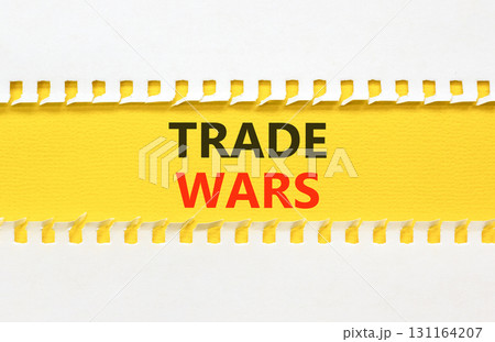 Trade wars symbol. Concept word Trade wars on beautiful white paper. Beautiful yellow paper background. Business trade wars concept. Copy space. Trade wars symbol. Concept word Trade wars on beautiful white paper. Beautiful yellow paper background. Business trade wars concept. Copy space. 131164207