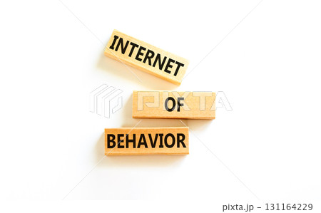 Internet of behavior symbol. Concept words Internet of behavior on wooden block on a beautiful white table white background. Business Internet of behavior concept. Copy space. 131164229