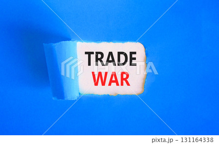 Trade war symbol. Concept word Trade war on beautiful white paper. Beautiful blue paper background. Business trade war concept. Copy space. 131164338