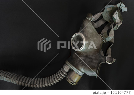 Very Old Gas Mask on Black Background Surface 131164777