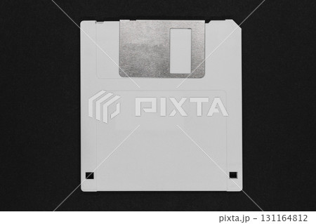 White floppy disk on black background White floppy disk on black background 131164812