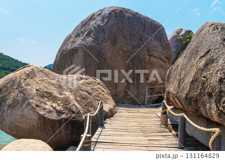 Wooden path and rocks in Nangyuan island beach in Thailand 131164829