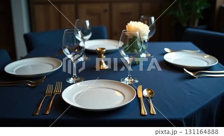 Elegant Minimalist Dinner Party Table Setting Awaiting Guests Overhead Elegant Minimalist Dinner Party Table Setting Awaiting Guests Overhead 131164888