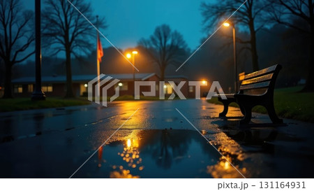 Night Rain Schoolyard with Lamp Reflections in Puddles and Lonely Bench Night Rain Schoolyard with Lamp Reflections in Puddles and Lonely Bench 131164931